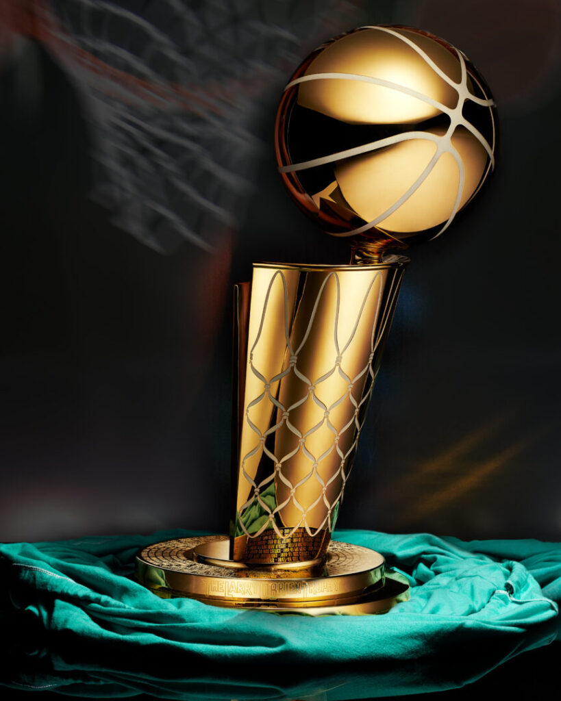 Basketball player about to dunk ball, close-up (blurred motion)